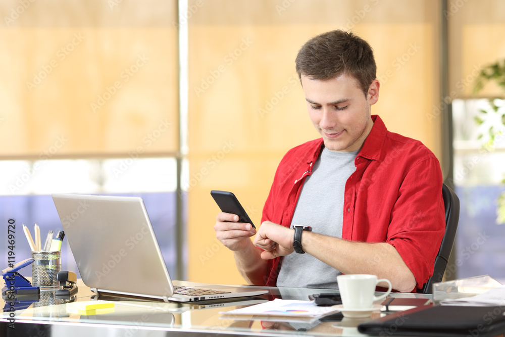Businessman using smart watch and mobile phone Businessman using smart watch and mobile phone