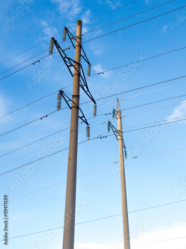 Power line on background of blue sky
