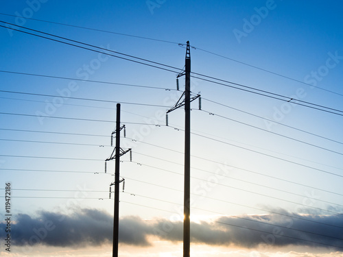 Power line on background of blue sky