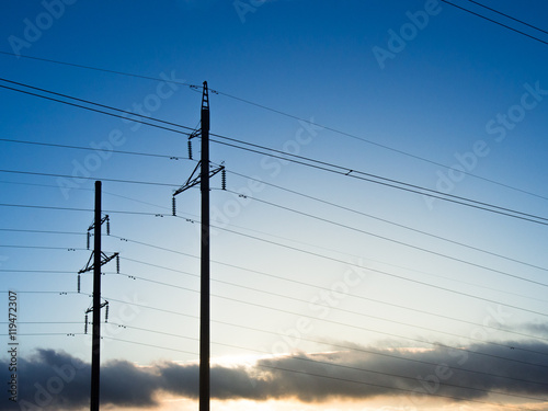 Power line on background of blue sky