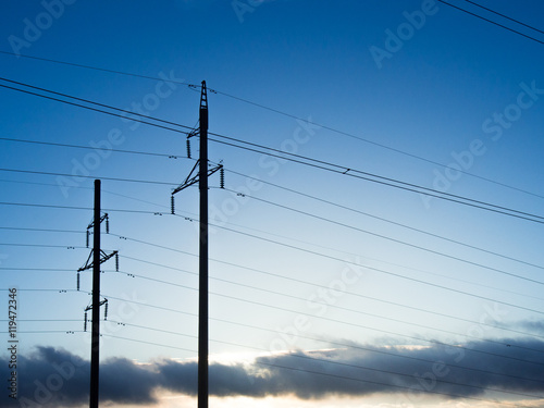 Power line on background of blue sky
