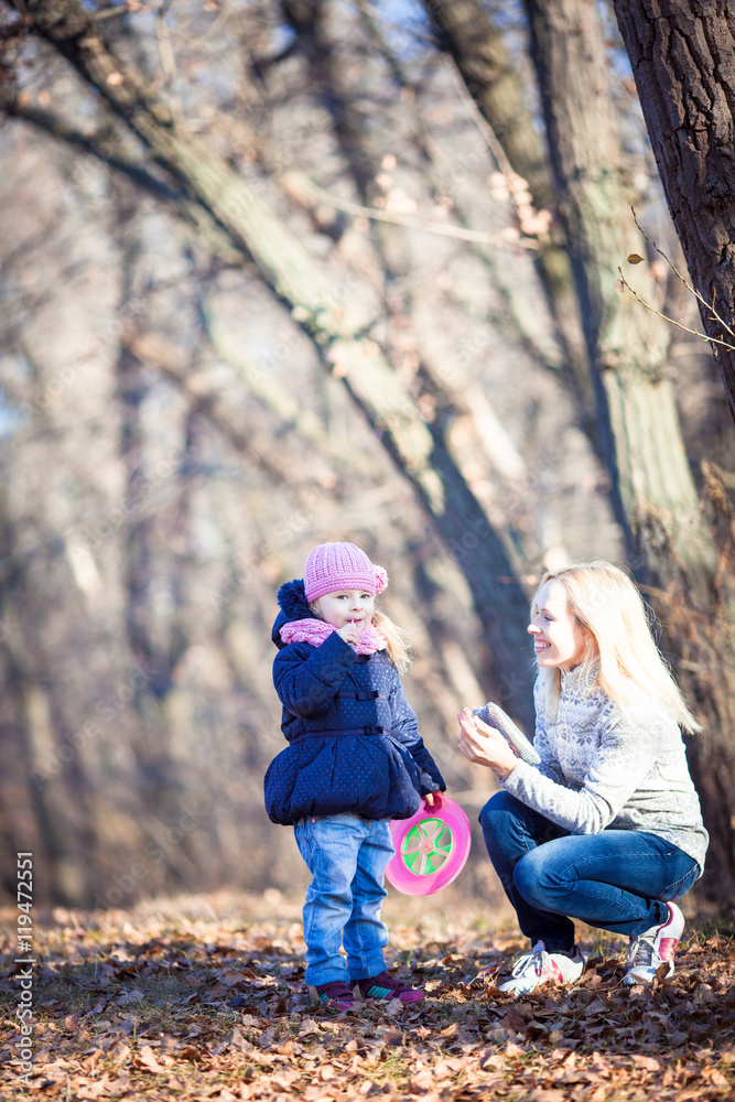 Young mother and her toddler girl in autumn fields Young mother and her toddler girl in autumn fields