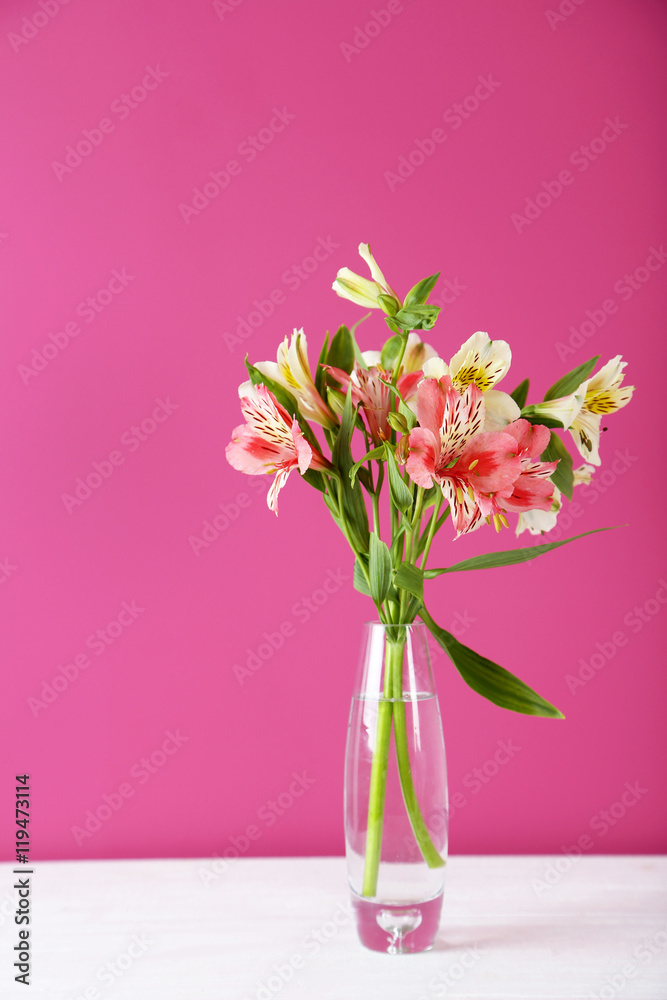 Beautiful alstroemeria flowers on a white wooden table