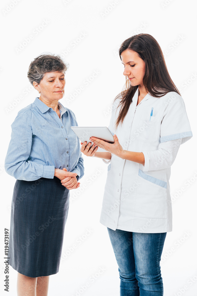 Doctor with pad explaining disease to patient Doctor with pad explaining disease to patient