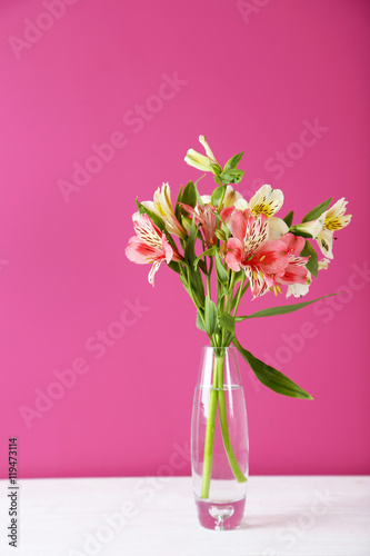 Beautiful alstroemeria flowers on a white wooden table