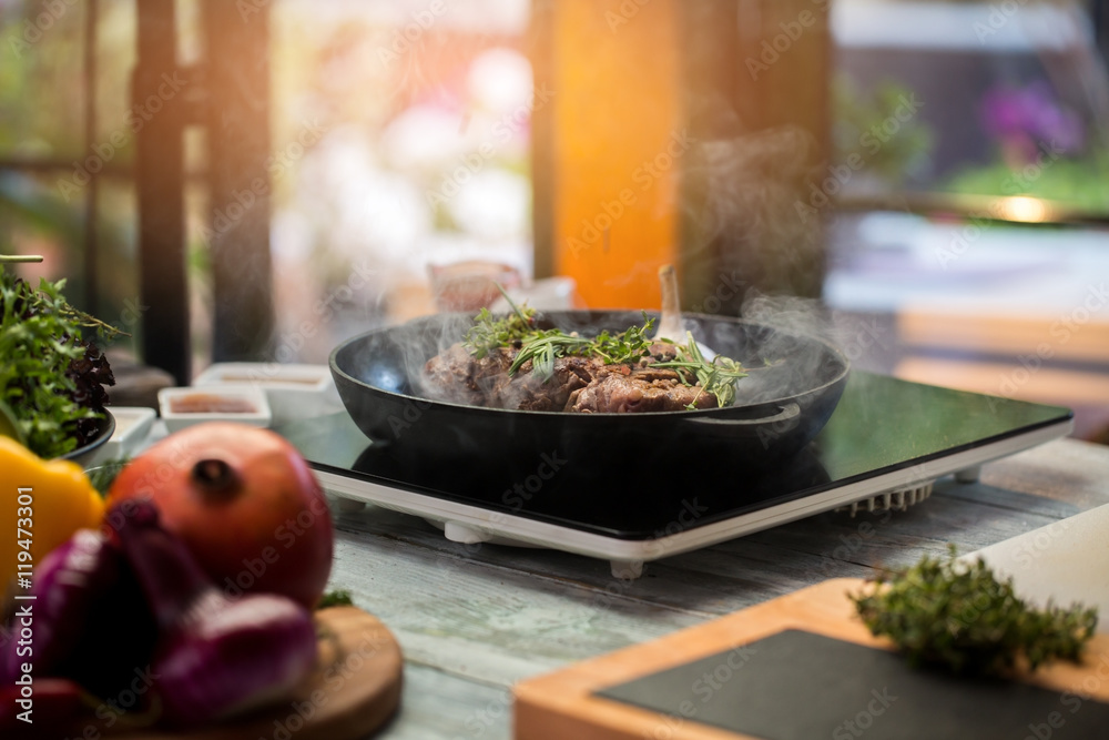 Pan with meat and herbs. Thyme and rosemary. Veal ribs with spice. It's a dish for gourmets. Pan with meat and herbs. Thyme and rosemary. Veal ribs with spice. It's a dish for gourmets.