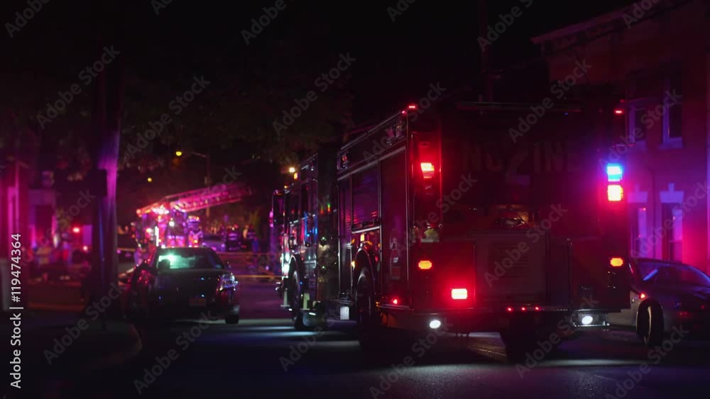 fire truck on residential street at night. all markings removed. fire truck on residential street at night. all markings removed.