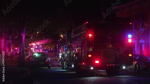 fire truck on residential street at night. all markings removed.