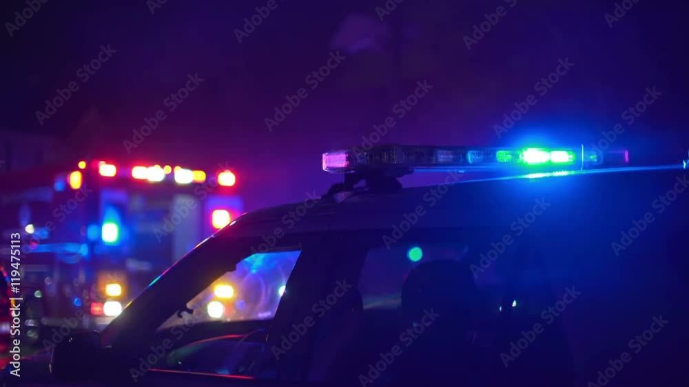 Emergency lights flashing at a scene of an accident