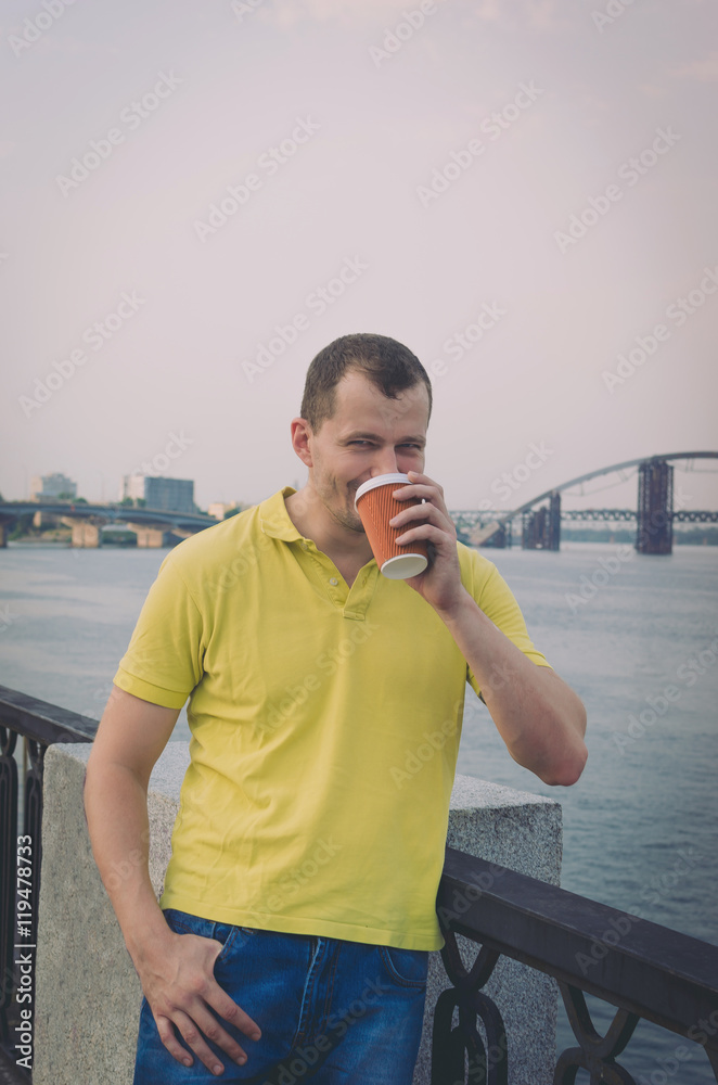 Fototapeta premium Attractive guy drinking coffee