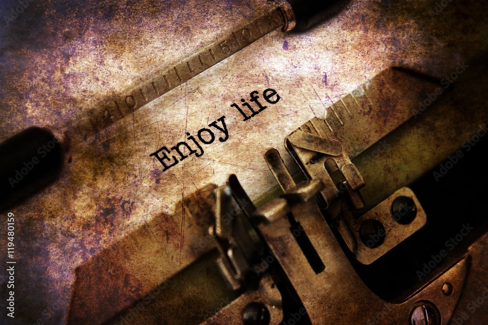 Enjoy life text on vintage typewriter