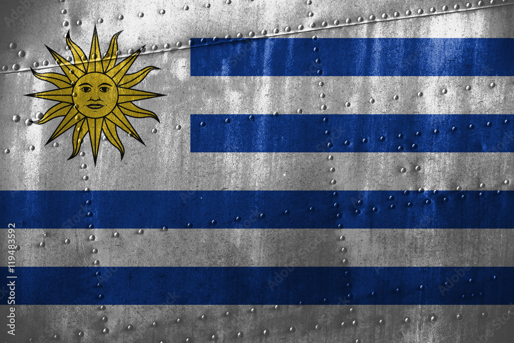 Fototapeta premium metal texutre or background with Uruguay flag