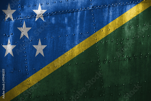 metal texutre or background with Solomon Islands flag