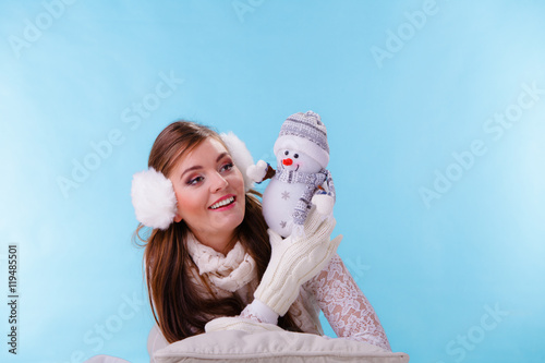 Cute woman with little snowman. Winter fashion.