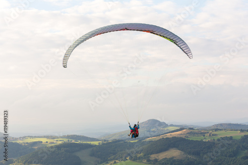 paraglider in the sky over wasserkuppe mountain in germany