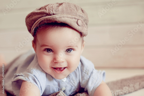 Adorable happy baby boy in a bright room