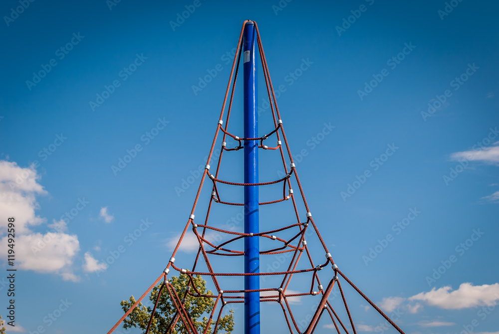 Abstract image of children's outdoor play equipment. Cloud and sky background with playground art. Minimal design and art image of street art. Children's play ground area
.