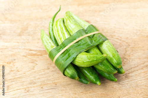 Snake gourd on wooden background photo