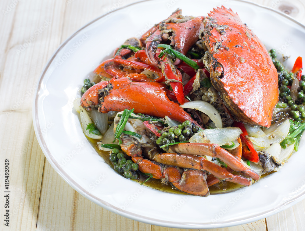 Stir fried crab with black pepper on white dish Stir fried crab with black pepper on white dish
