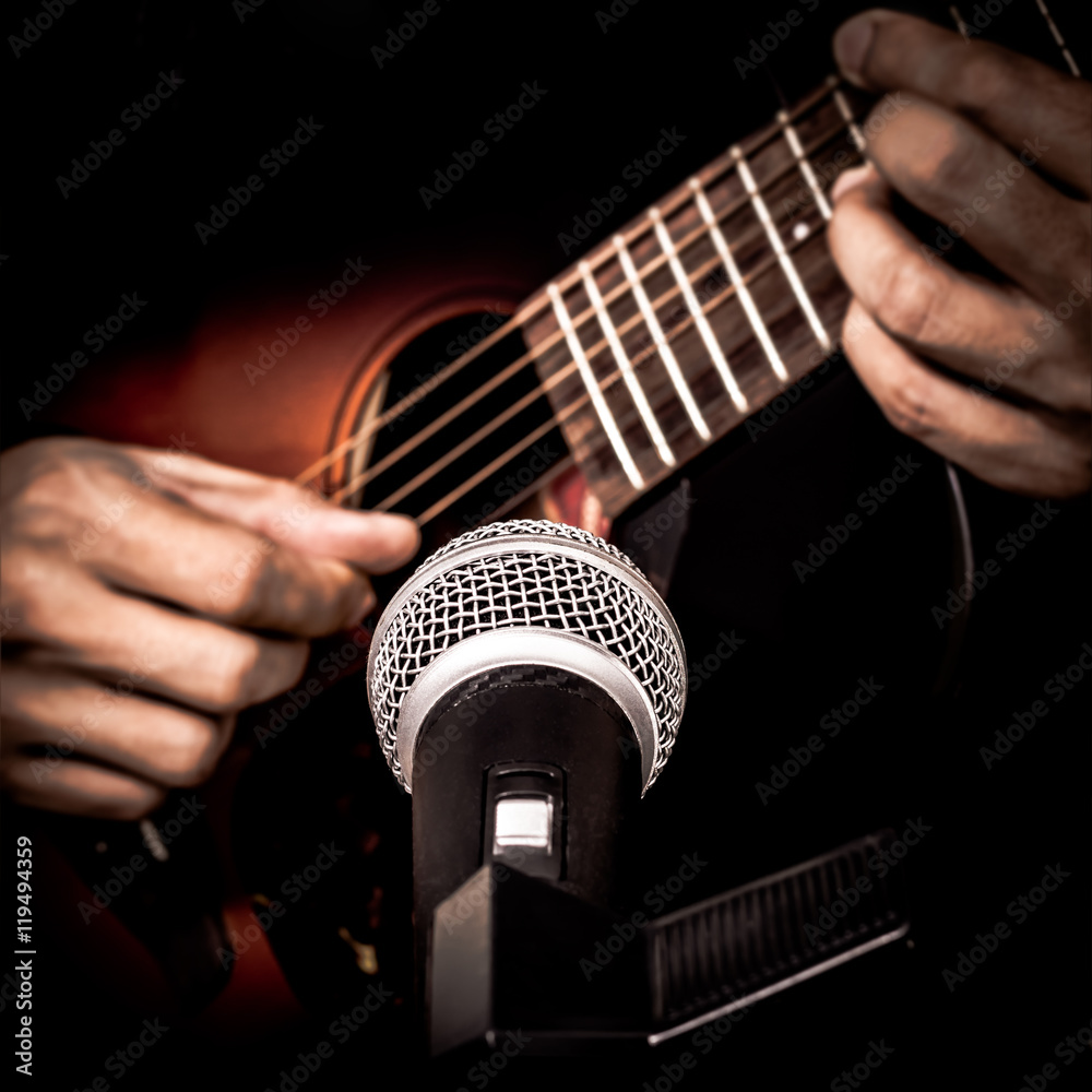 Fototapeta premium musician hands playing & recording acoustic guitar
