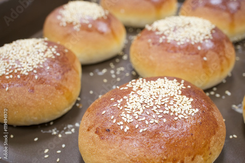 Brown bread baked with white sesame on oven tray