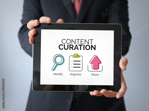 businessman with content curation concept on a tablet photo