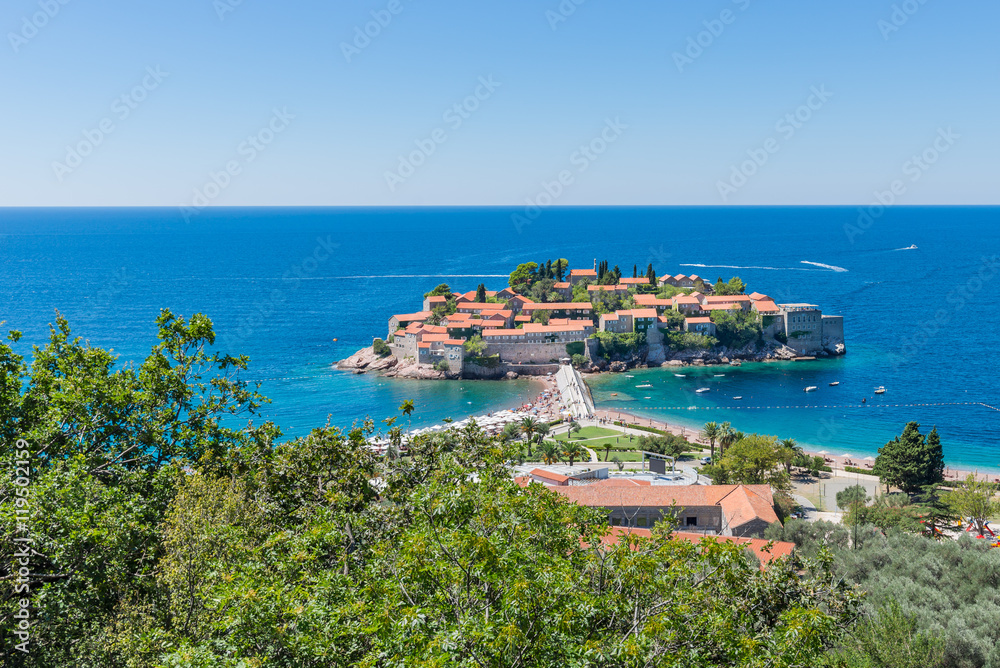 View of the island of Sveti Stefan from the hill on a sunny day.