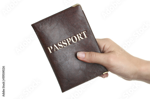 Passport in hand on a white isolated background