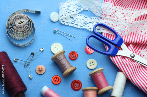 Sewing kit on green background photo