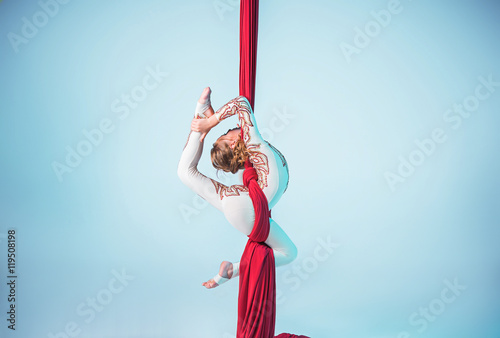 Graceful gymnast performing aerial exercise photo