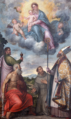 BRESCIA, ITALY - MAY 23, 2016: The painting Madonna with the saints Francis of Assisi, John the Evangelist and st. Jerome and bishop Honorius in Chiesa di San Alessandro by G. Rossi (1547 - 1614). photo