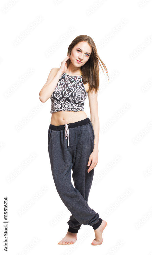 Young cheerful woman in a home clothes posing full-length isolated on white background Young cheerful woman in a home clothes posing full-length isolated on white background