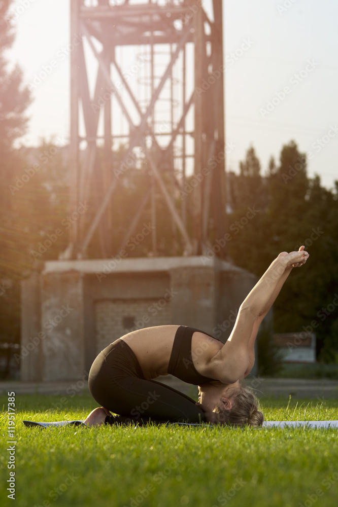 Fototapeta premium Flexible woman in sportswear doing yoga