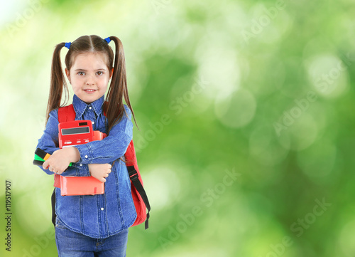 Little girl with backpack h...
