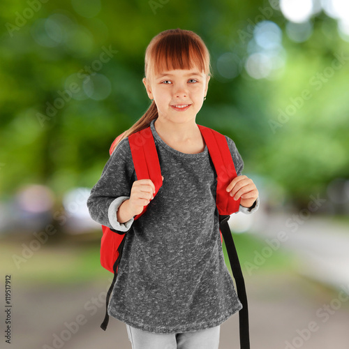Little girl with backpack o...