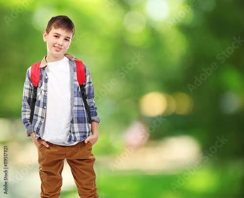 Cute boy with backpack on b...