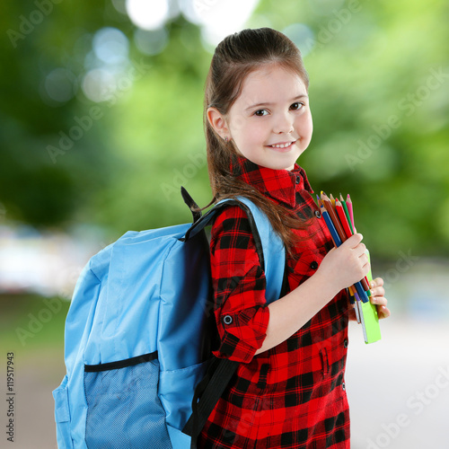Little girl with backpack h...