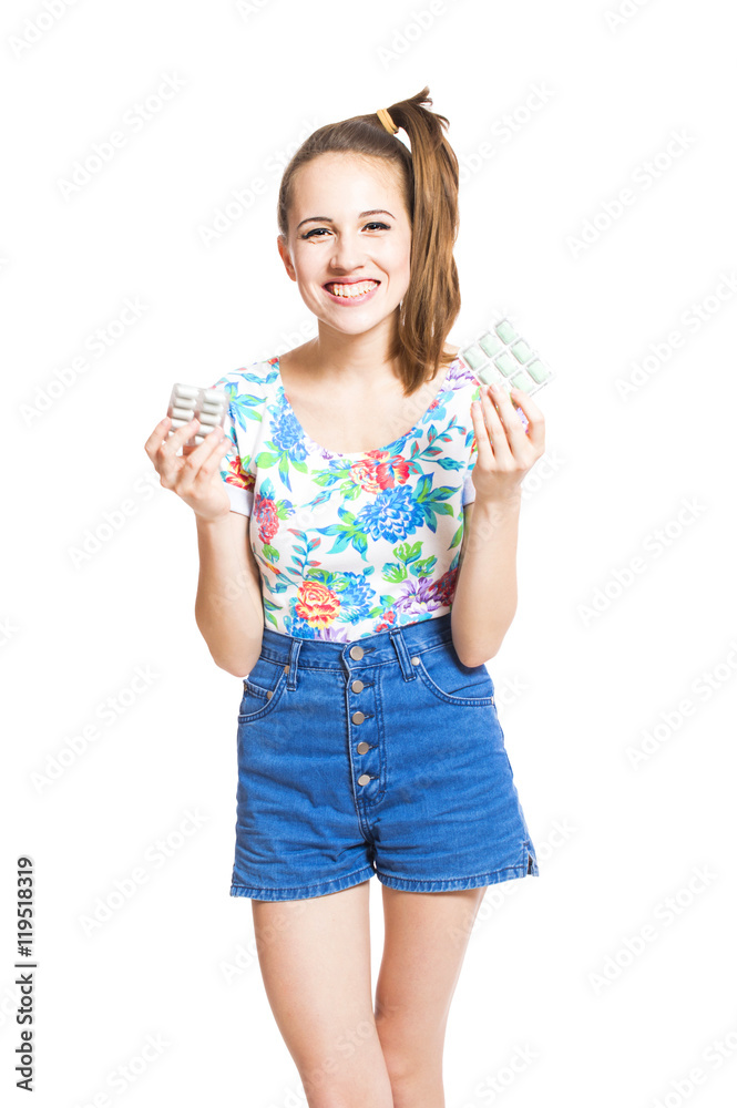 Funny young teen girl in a bright blouse and shorts chewing gum isolated on white background. Funny young teen girl in a bright blouse and shorts chewing gum isolated on white background.