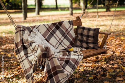 Large swings with a cozy blanket