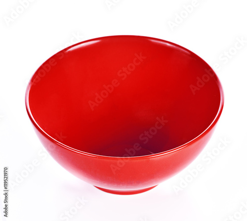 Empty red ceramic bowl on white background