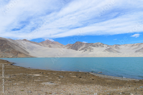 Mount Muztag Ata, the father of ice mountains, and the Karakul Lake, on the Pamirs Plateau, Taxkorgan, Kashgar, Xinjiang, China photo