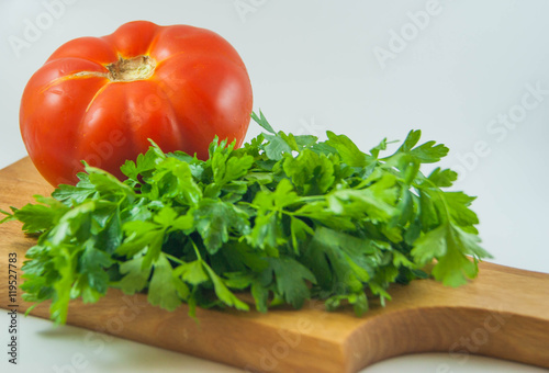 Organic fresh red tomatoes and parsley isolated
