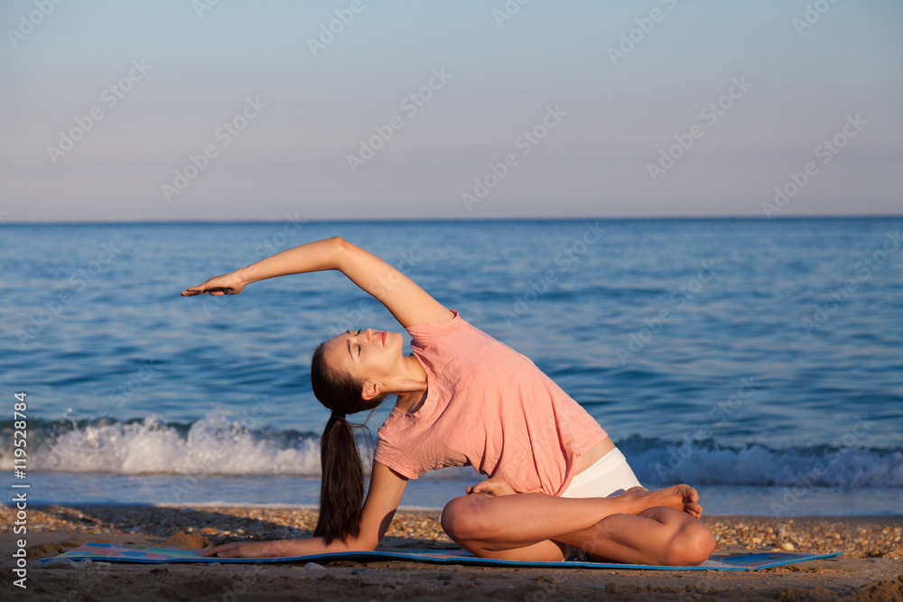 girl deals with Yoga on the beach