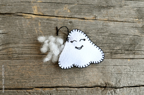 Sewing felt Halloween ghost decor. Join the felt edges of the toy using a blanket stitch and stuff with hollowfiber. Step. Sewing tutorial for children. Halloween diy idea. Closeup. Top view photo