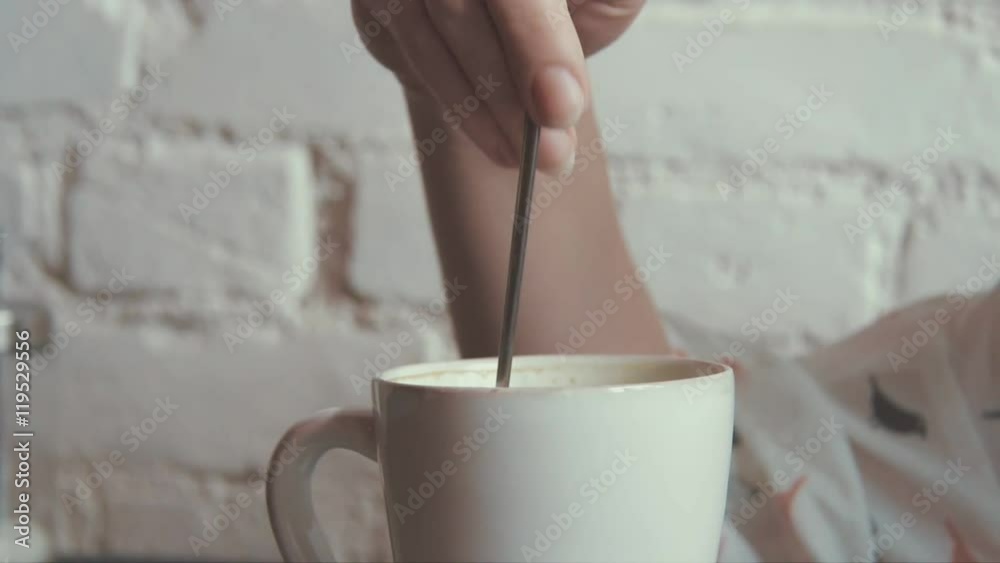 happy young beautiful woman drinking coffe in the cafe