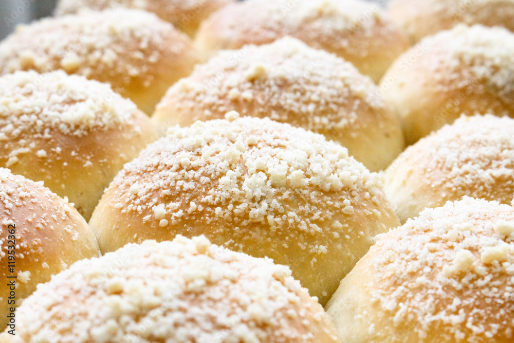 fresh hot sweet baked buns, close-up photo.