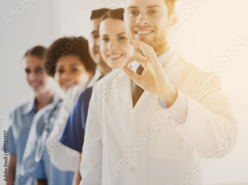 close up of doctors showing ok sign at hospital