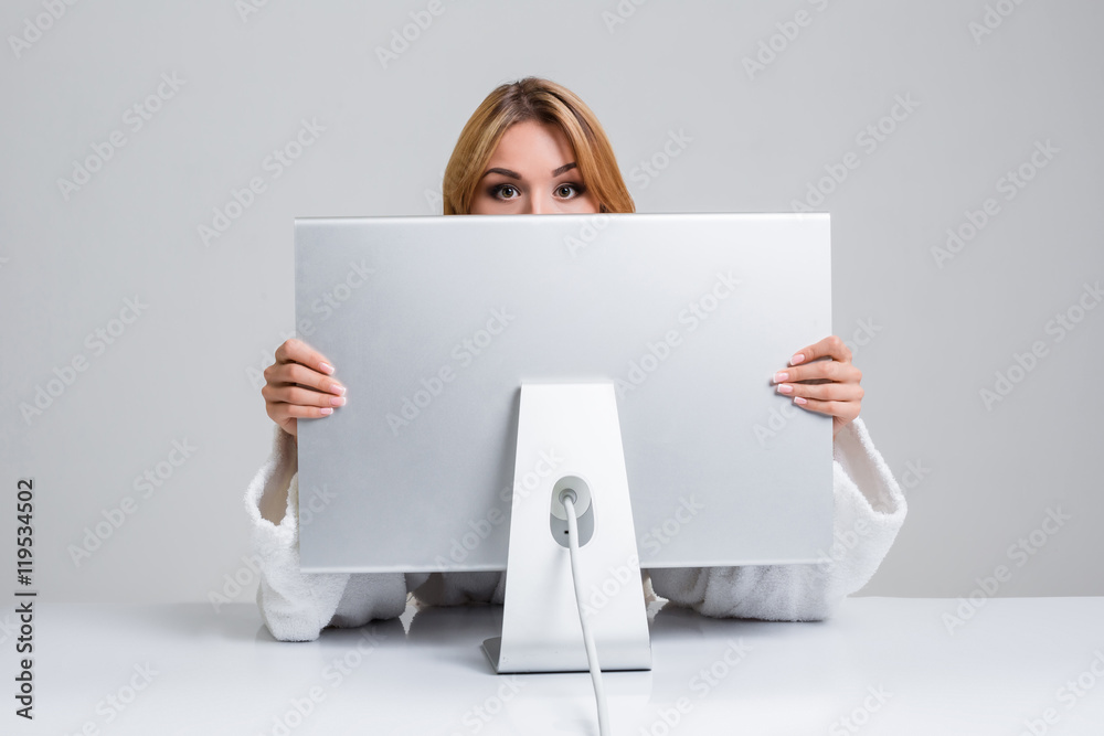 young woman sitting in the table and using computer young woman sitting in the table and using computer