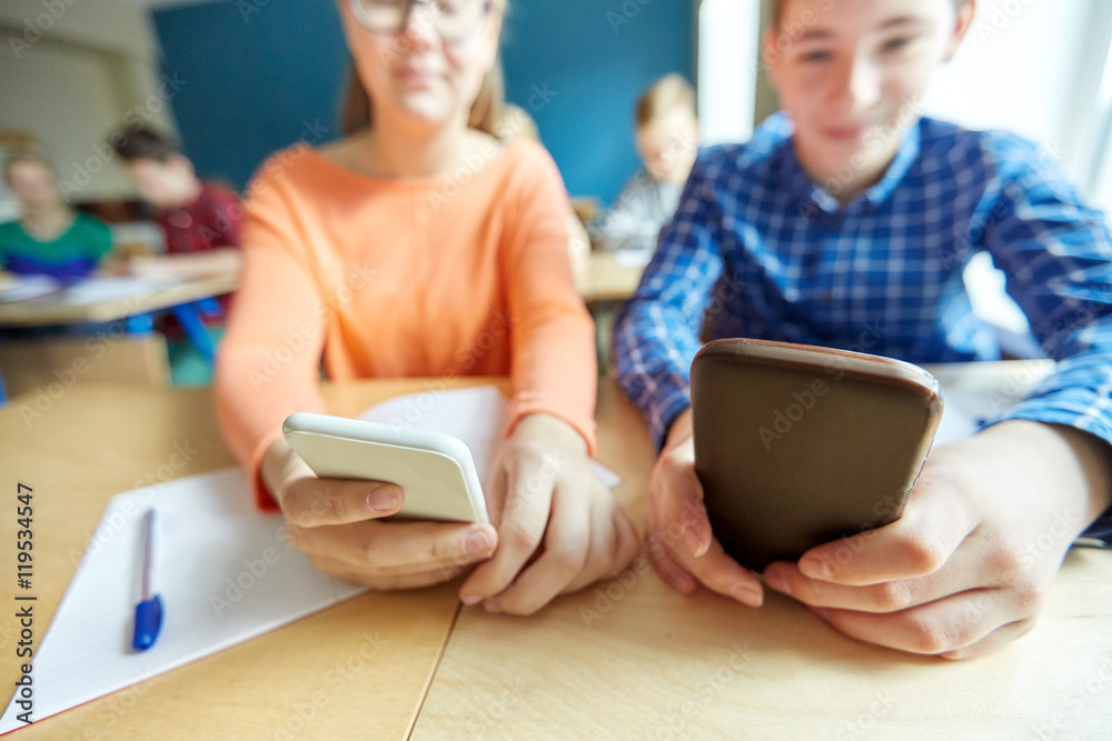 high school students with smartphones texting high school students with smartphones texting
