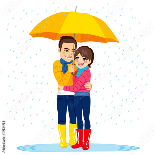 Young couple standing under...